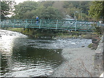 SH5948 : River confluence and footbridge in Beddgelert by Peter Shone