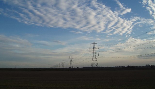 Fenland sky and pylon chain.