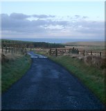 NT7366 : Cattle Grid and long view towards Ecclaw by Kirsty Smith