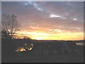 Sunrise over Achnaba Cottages by the A83.