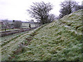 The slope leading to the standing stone