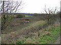 Over an unnamed stream (currently a streak of mud) towards the M25.