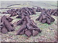 HU1851 : Peat stacks near the Simli Field by Rog Frost
