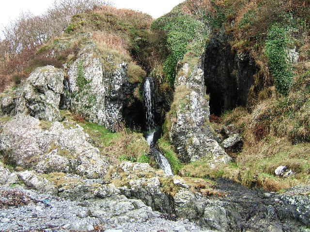 A waterfall over caves at the end of Sandeel Bay (Port Mora Bay) near Portpatrick.