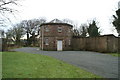 Lodge on south side of lane to Lathom Park