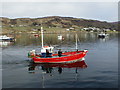 NG3863 : Fishing boat leaving Uig Bay by Dave Fergusson