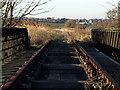 SH4673 : Railway lines on disused Bridge by Nigel Williams