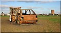 Burned-out car with Water Tower