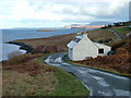 NG3553 : Roadside Cottage in Kildonan by Dave Fergusson