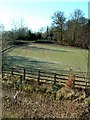 Lodge house across fields