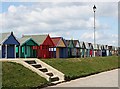 TF5282 : Beach Huts along the Promenade by Tony Atkin