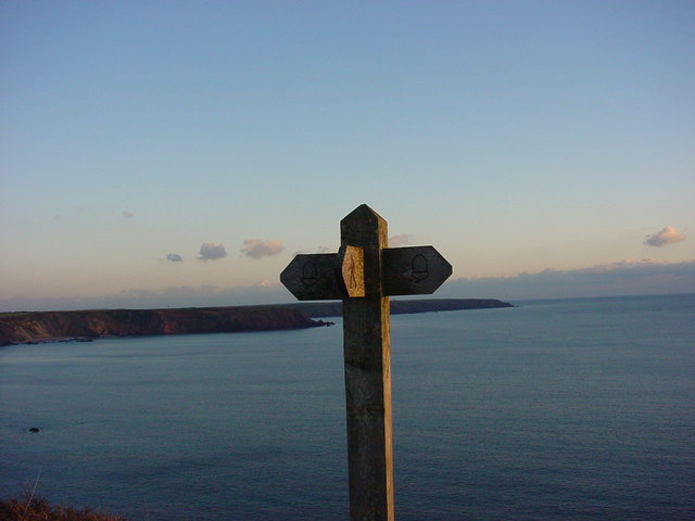 Marloes footpath sign and view of sea