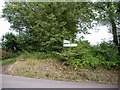 Signpost at T junction east of Stoke