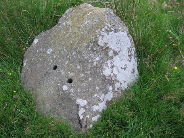 Shot holes in one of the stones in Hoarstones stone circle