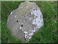 Shot holes in one of the stones in Hoarstones stone circle