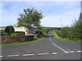 Looking down the unclassified road from Eckford that joins up with the A698 after 0.5km