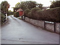 Bonsonwood lane with phone box behind photographer