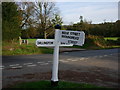 Signpost at road junction just a short distance from the A271