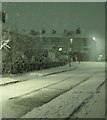 Snow falling on Edgar Street, Huncoat, at night