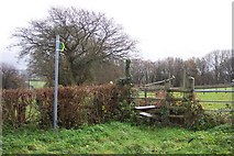 SO5700 : Footpath sign and stile. by Jonathan Billinger