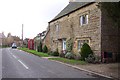 Stone cottage and phonebox in Kingham