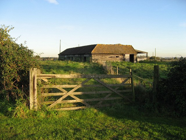 A Wooden Gate And Barn