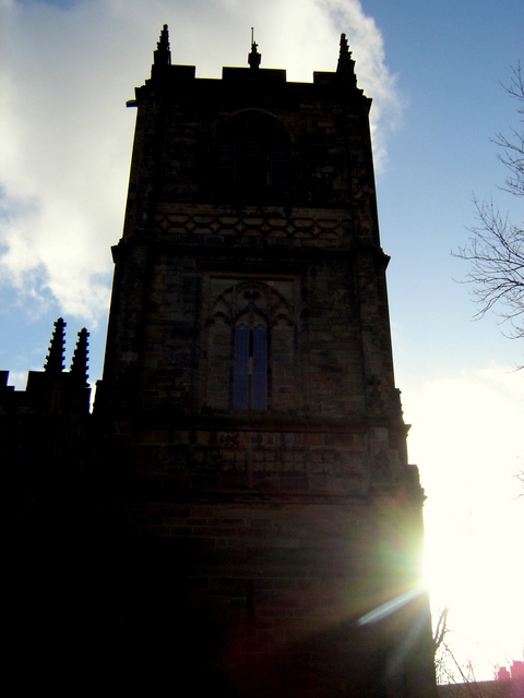 The church tower at St Mary's church, Mold, in silhouette