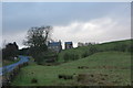 House with tall barn near Thirlwall Castle