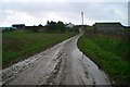 SW9445 : View south down muddy road to Furda by Kieran Evans