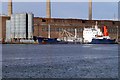 Cem River discharging cement at the Stormont Wharf