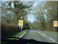 Road into Longburton  showing village name sign and speed limit