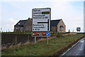 Road sign and house at Hillcrest.