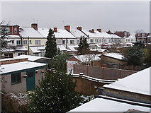 TQ2081 : North Acton houses in snow by David Hawgood