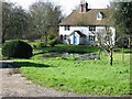 House and pond at the bottom of Stowting Hill