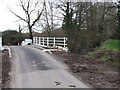 TM1491 : Repaired Bridge over Stream, Low Common by Ian Robertson