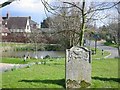 TL1778 : Upton village and pond from the churchyard by Chris Stafford