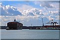 Container ship tugged into dock, Southampton