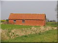 Barn in the middle of a field