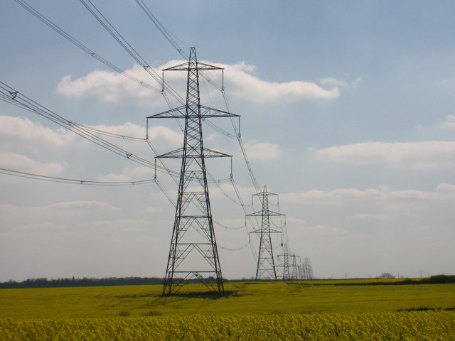 Electricity pylons across open farmland