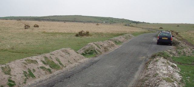 Unfenced road with earth barriers