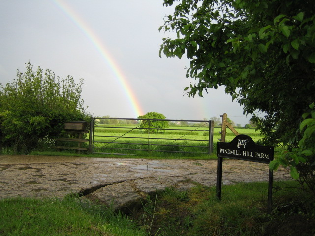 Rainbow and farm road near Sandhill
