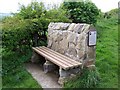 Bench facing south east by the side of the footpath