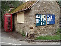 Easton Maudit notice board and red phone box