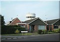 Water tower over bungalows