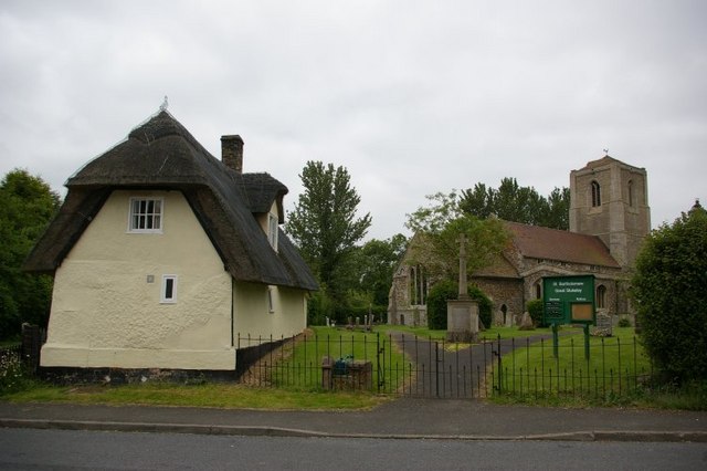St Bartholomew's church with neighbouring thatched cottage