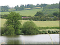 View across Hartleton lake. M50 traffic trundling through.