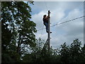 SK0707 : Lady pole climbing Telephone Engineer by Pete Freeman