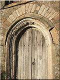 SS5608 : West doorway, Iddesleigh church by Derek Harper