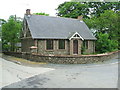 NJ9437 : Cottage at Arnage Home Farm road by Ken Fitlike