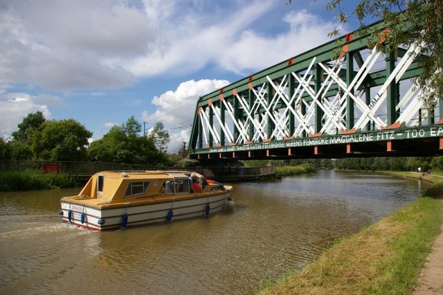 Pleasure boat approaching railway bridge